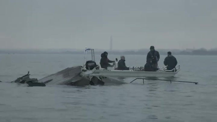 Moment US army helicopter wreckage pulled from river after DC plane crash