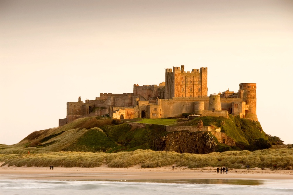 Behold the beauty of the castle at Bamburgh Beach (Getty Images)