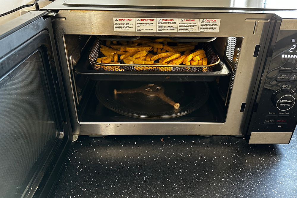 You can microwave food before crisping it up, thanks to this dual-use model (Rachael Penn/The Independent)