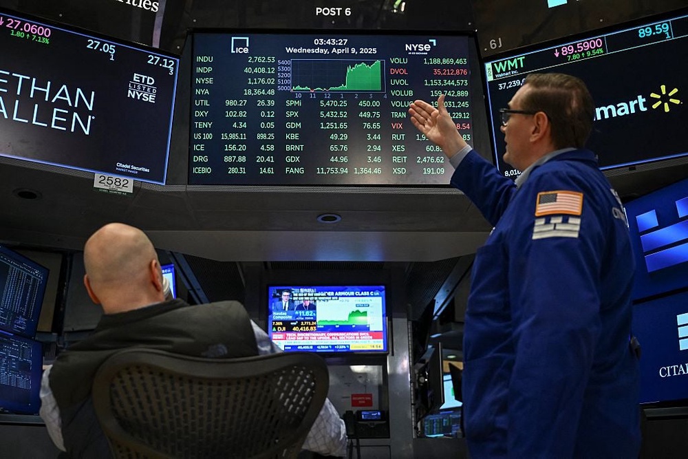 Traders work on the floor of the New York Stock Exchange on April 9, 2025, after Trump announced he was pausing the trade tariffs for 90 days (AFP/Getty)