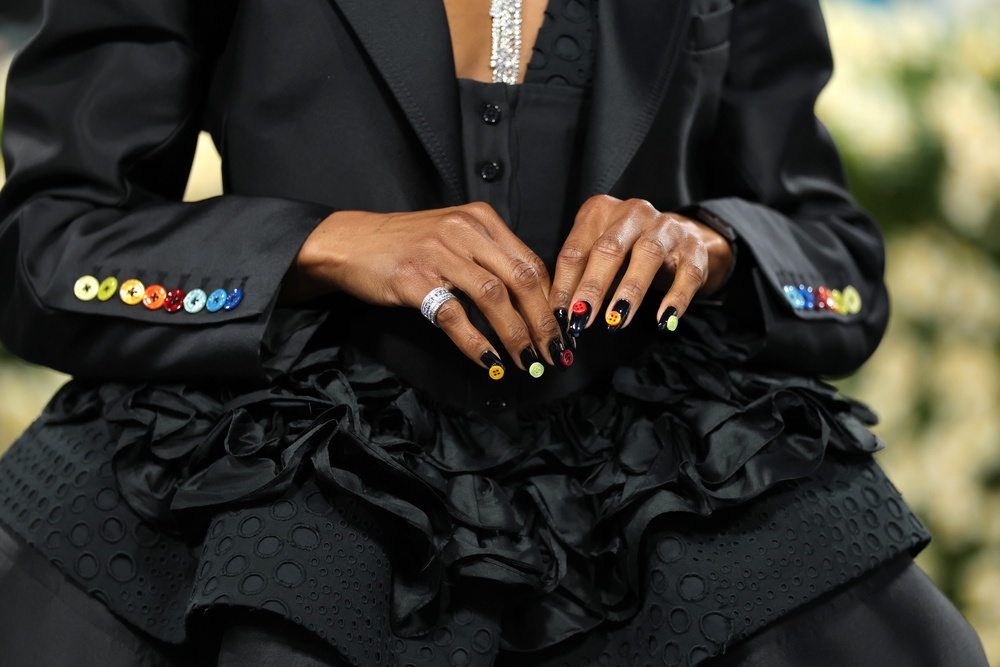 Nwodim’s black jacket featured rainbow buttons along the sleeves, which matched the multicolored buttons attached to her black-painted nails (Getty Images)