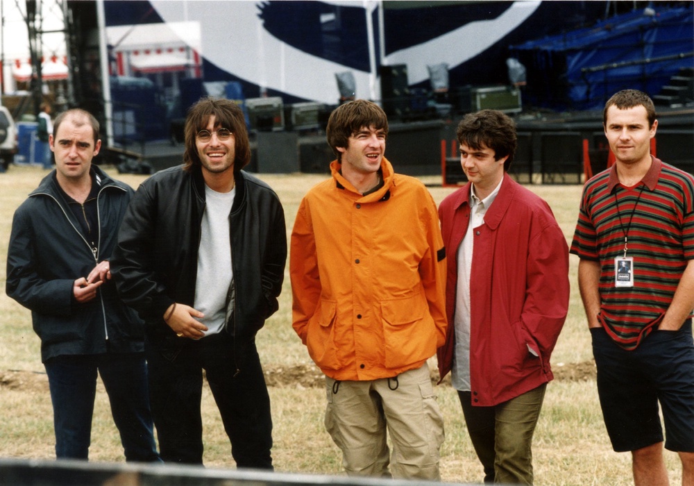 Oasis at Knebworth in August 1996 (PA)