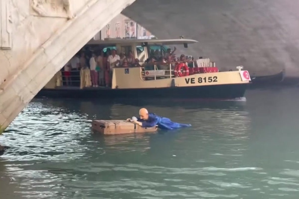 Life-size mannequin of Jeff Bezos lying on a giant Amazon box dropped ...