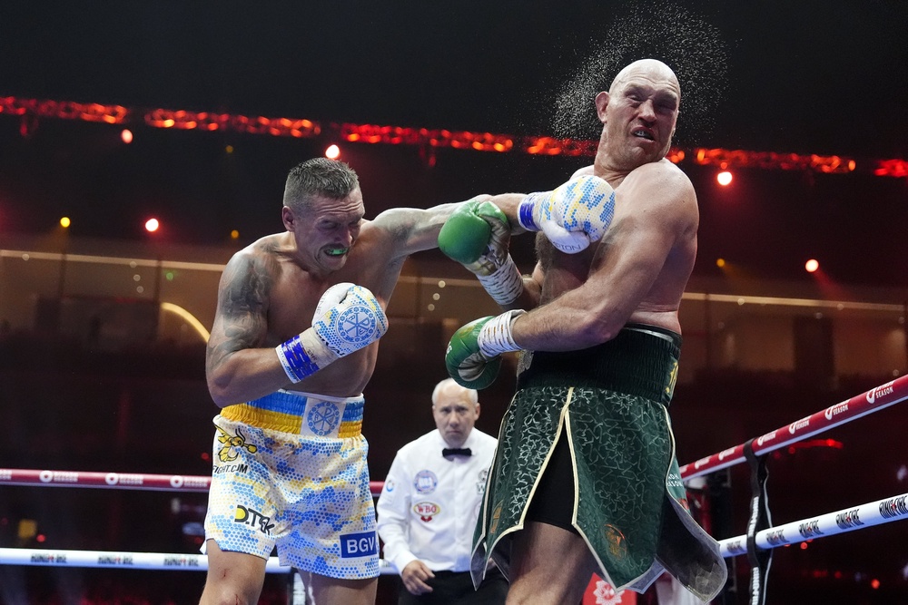 Fury (right) twice lost on points to Oleksandr Usyk (left) (PA Wire)