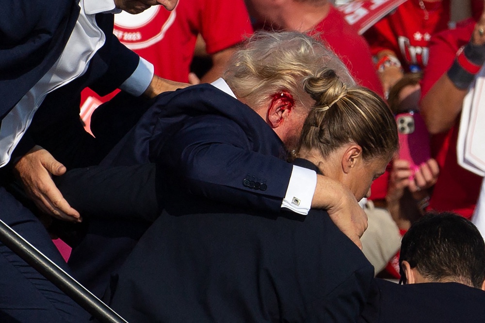 On July 13, 2024, Trump was at a campaign rally in Butler, Pennsylvania, when a 20-year-old gunman fired a bullet that grazed the then-presidential candidate's ear (AFP/Getty)