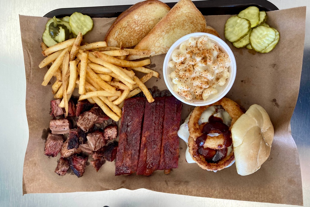 The BBQ platter at Joe’s Kansas City, one of the most celebrated restaurants in the city (James March/The Independent)