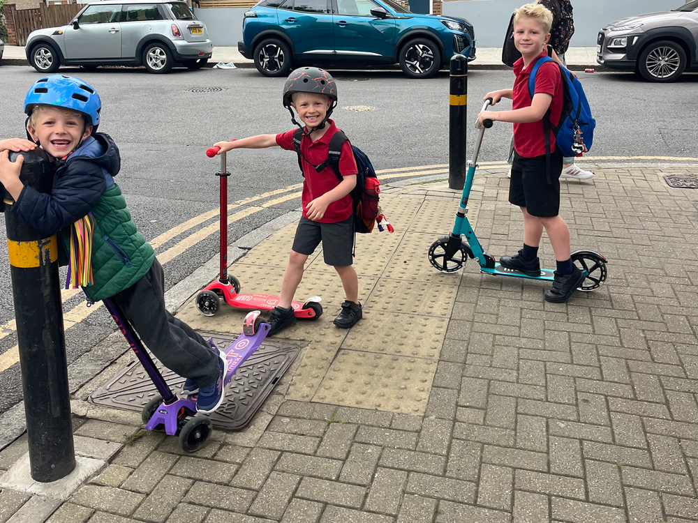 My trio of testers were happy to take these scooters out for a spin (Kat Storr/The Independent)