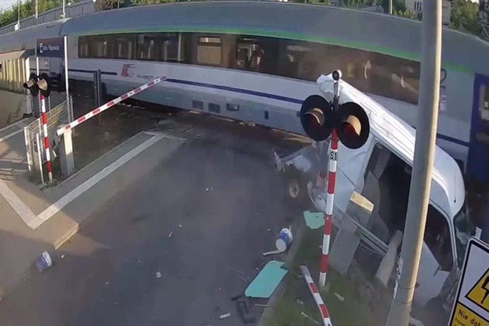 Driver has miracle escape after train obliterates van stuck on level ...