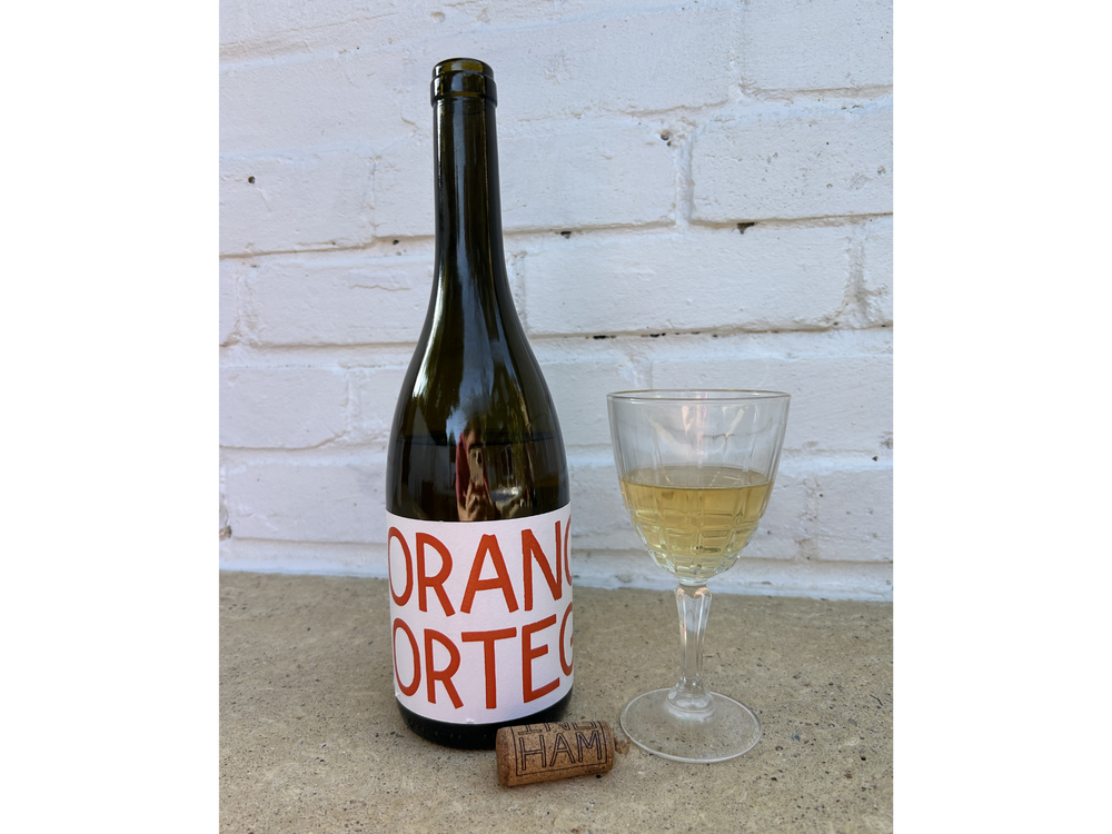 Tillingham's ortega orange wine has a savoury taste that pairs well with bar snacks (Emma Henderson/The Independent)