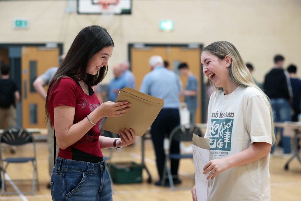 Isabelle Myles (left) and Hollie Wilson receive their A-level results at Sullivan Upper School in Holywood (Liam McBurney/PA) (PA Wire)