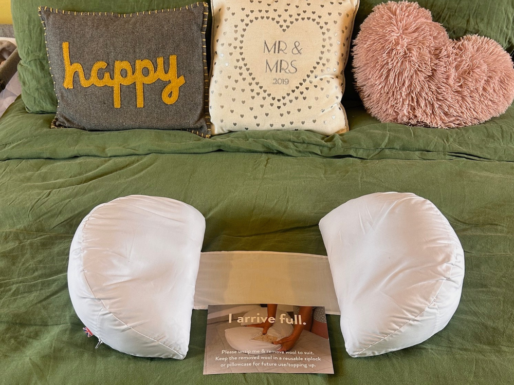 A wedge pillow like this is helpful if you’re tight on bed space (Katie Byrne/The Independent)