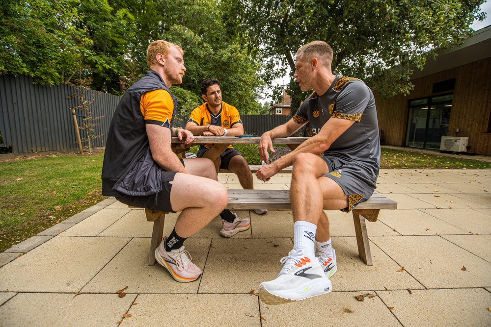 The Independent's senior fitness writer Harry Bullmore speaking with Cambridge United FC captain Michael Morrison during a Brooks Running event (Brooks Running)