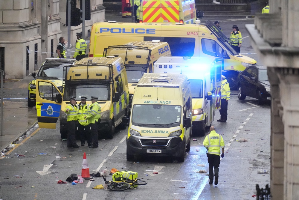 Police and emergency personnel on Water Street, Liverpool, following the crash after the victory parade (PA Wire)