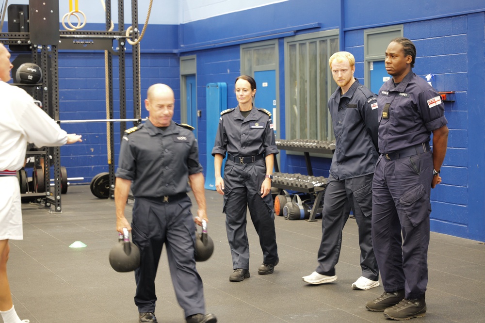 Lieutenant Commander Joseph Wood demonstrates the kettlebell carry (Royal Navy / Nigel Huxtable)