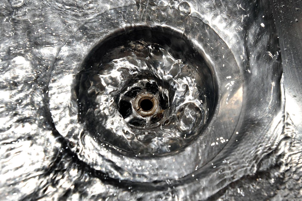 Four people have been accused of conspiring to defraud the Environment Agency (EA) and the water regulator, Ofwat (PA)