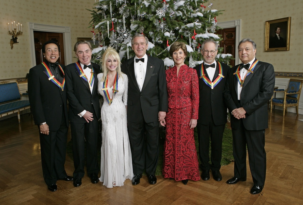 Dolly Parton accepted the Kennedy Center Honors from President George W Bush in 2006 (along with Smokey Robinson, Andrew Lloyd Webber, Steven Spielberg and Zubin Mehta), but later turned down the Presidential Medal of Freedom three times (Getty)
