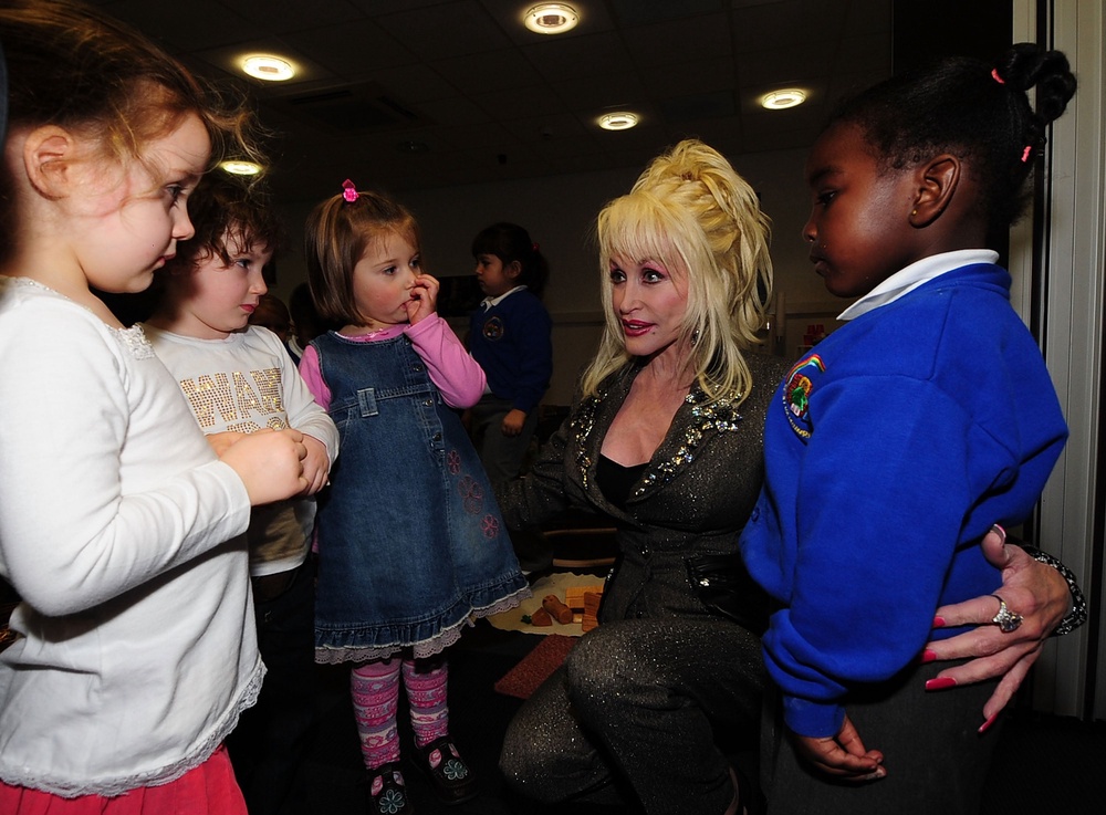 Dolly Parton meeting schoolchildren in Rotherham during the launch of the UK's first Imagination Library. She told The Independent she wanted to be remembered as ‘someone who brought books to children all over the world’ (Getty)