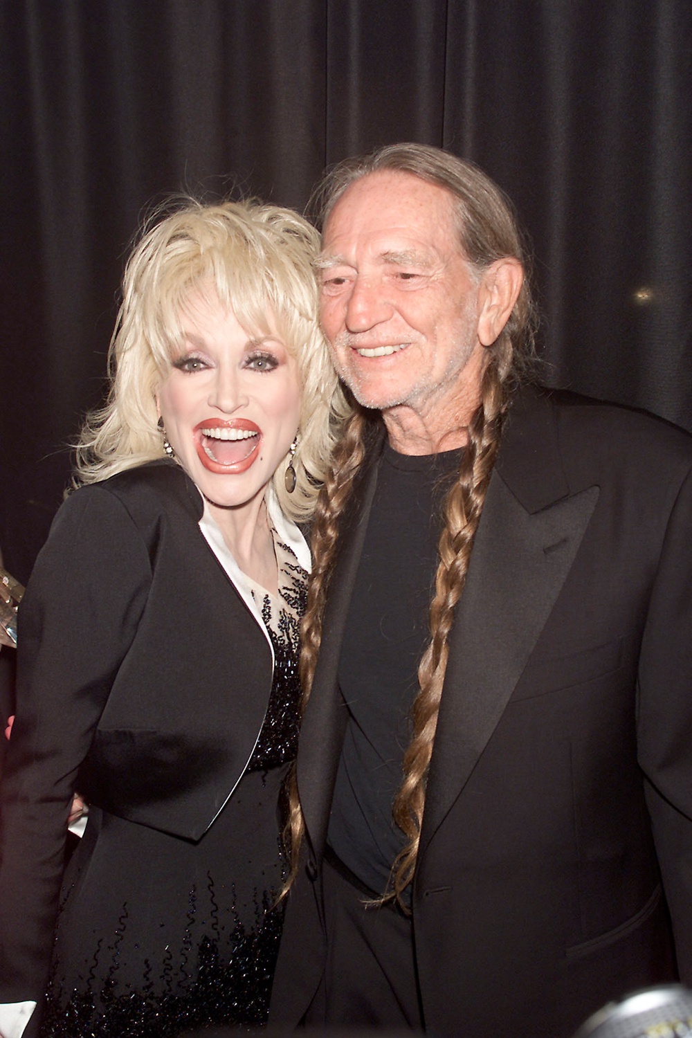 Dolly Parton with fellow country icon and collaborator Willie Nelson in 2001 (Getty)