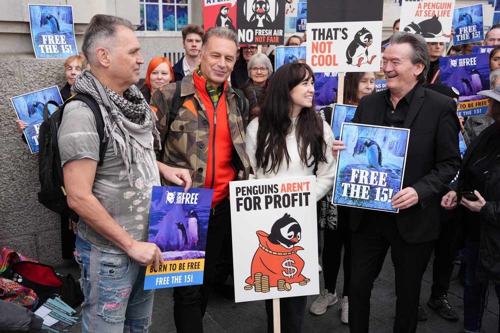 (left-right) Dale Vince, Chris Packham, Megan McCubbin and Feargal Sharkey at the Free the Fifteen protest organised by Freedom for Animals with support from Born Free, who are calling for a group of 15 Gentoo penguins to be freed from their basement enclosure, at Sea Life London (PA Wire)