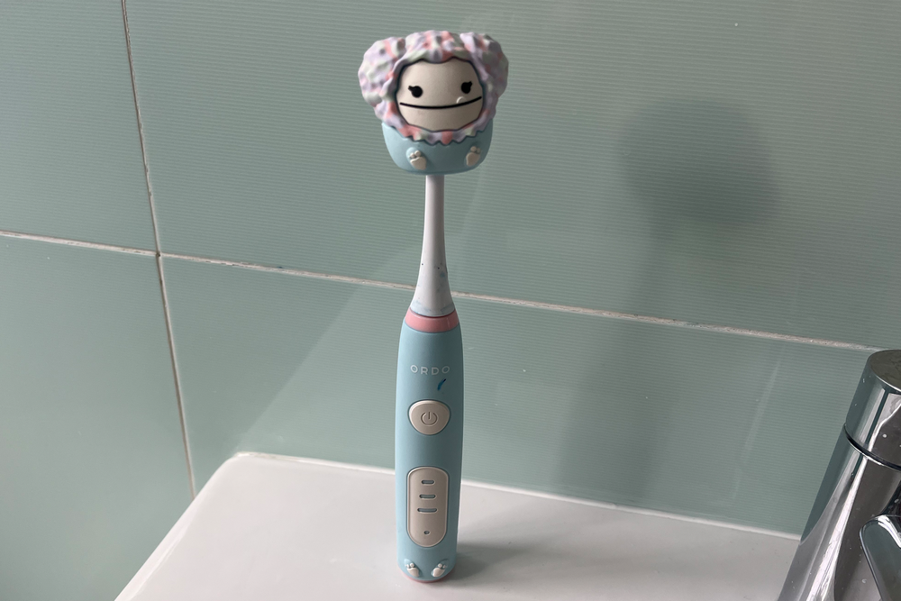 This toothbrush shows your time progress in lights (Kat Storr/The Independent)