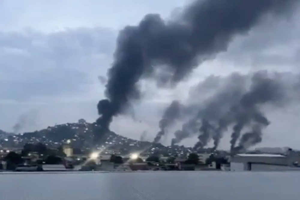 Explosions seen across Rio as largest-ever police drugs raid leaves 64 dead