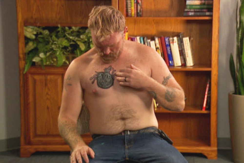 In this photo provided by WGME, Graham Platner, a democratic candidate for U.S. Senate, points to a cover-up tattoo that had previously been an image recognized as a Nazi symbol (AP)