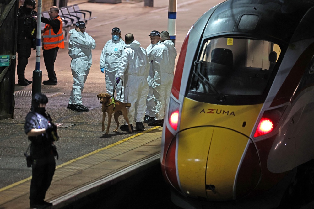 Police on the platform by the train at Huntingdon station (Chris Radburn/PA Wire) (PA Wire)