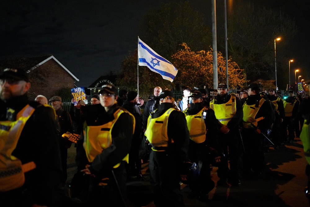 Pro-Israel supporters are led away from Villa Park, home of Aston Villa by police officers, before the match against Maccabi Tel Aviv last November (PA) (PA Wire)
