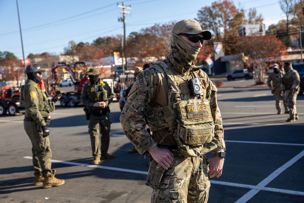Federal immigration agents taking part in Operation Charlotte’s Web in Charlotte, North Carolina, last November (Getty)
