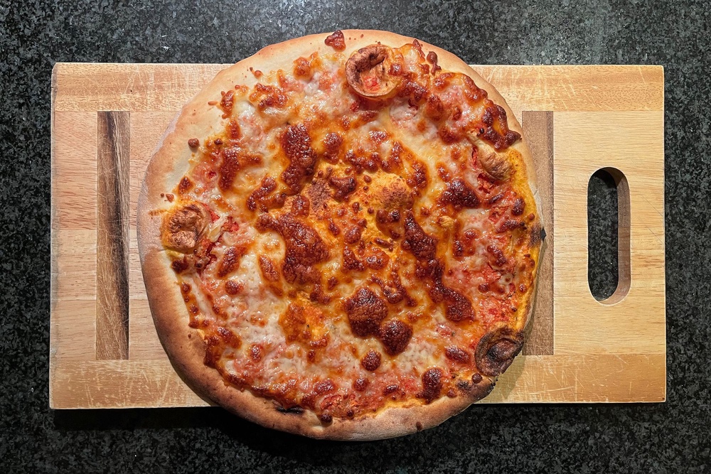 This pizza’s dough is slow-proved and individually hand-stretched (Alice Reynolds/The Independent)