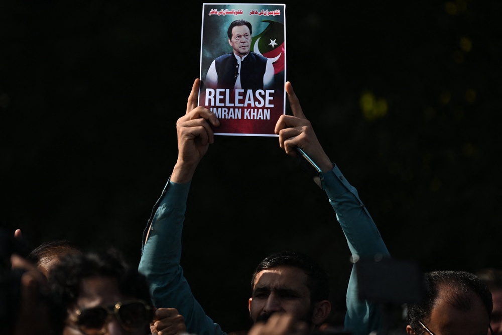 File. Pakistan Tehreek-e-Insaf (PTI) party supporters protest to demand the release of their jailed leader and Pakistan’s former prime minister Imran Khan, in Islamabad on 2 December 2025 (AFP/Getty)