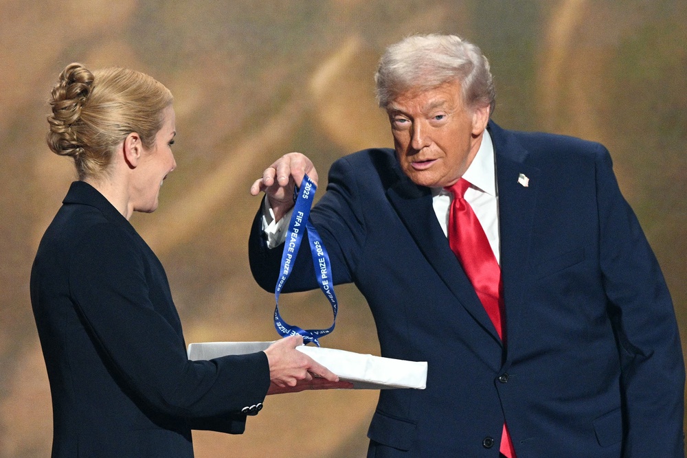 Trump accepts the inaugural Fifa Peace Prize during the draw for the World Cup at the Kennedy Center in December last year (AFP/Getty)