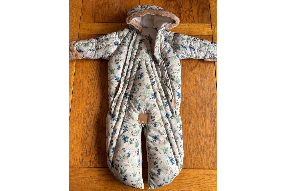 While a beautiful design, the Elodie pramsuit is a little fiddly to get a baby into (Katie Byrne/The Independent)