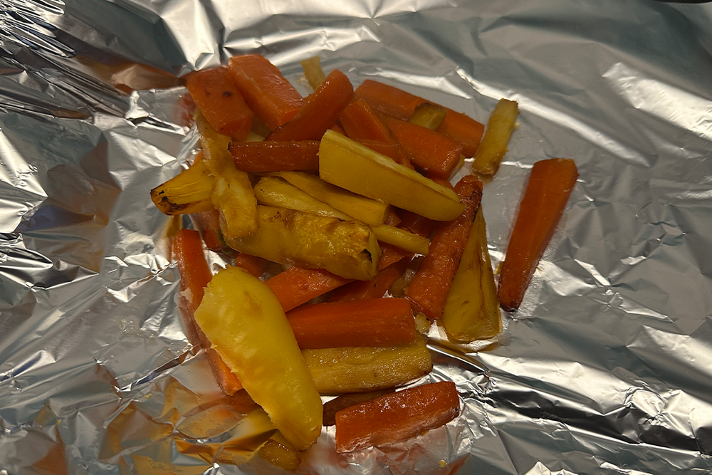 Foil can help you keep elements of the meal warm while others are cooking (Rachael Penn, The Independent)