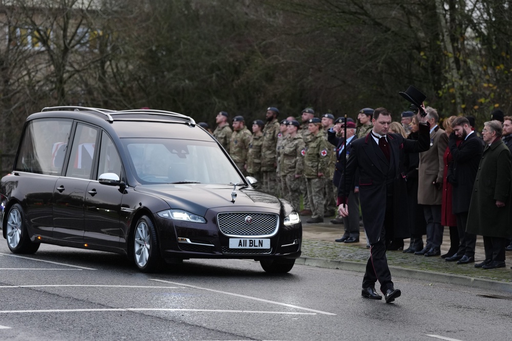 The cortege carrying the body of Lance Corporal George Hooley passes the Memorial Garden in Carterton, West Oxfordshire, following his repatriation into RAF Brize Norton (Ben Whitley/PA) (PA Wire)