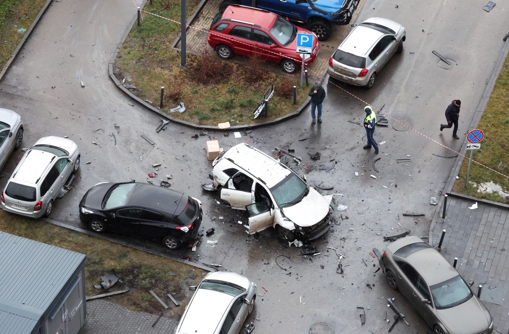 The damaged Kia Sorento lies at the scene where Fanil Sarvarov, head of the Russian General Staff’s army operational training directorate, was killed last December (Reuters)
