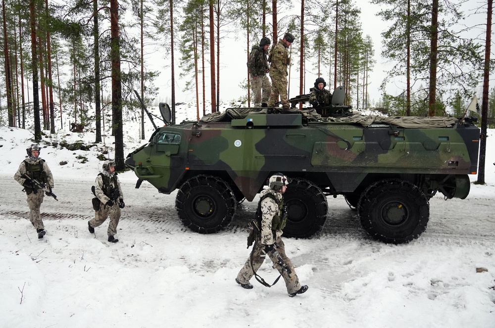Members of the Finnish army and British army in a Patria Pasi armoured vehicle in Vuosanka near Kajaani in Finland last December (PA)