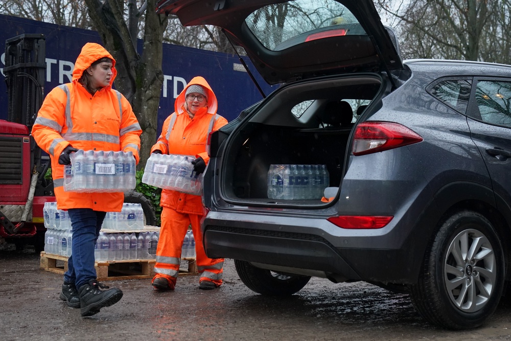 South East Water staff hand out bottled water at a water station in Maidstone, after bad weather was blamed for more water outages in Kent and parts of Sussex at the end of 2025 (PA Wire)
