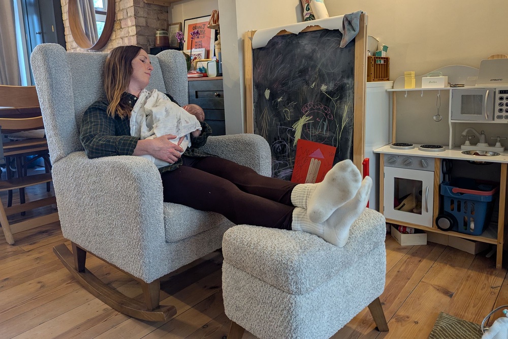 The footstool acts as handy storage (Emilee Tombs/The Independent)