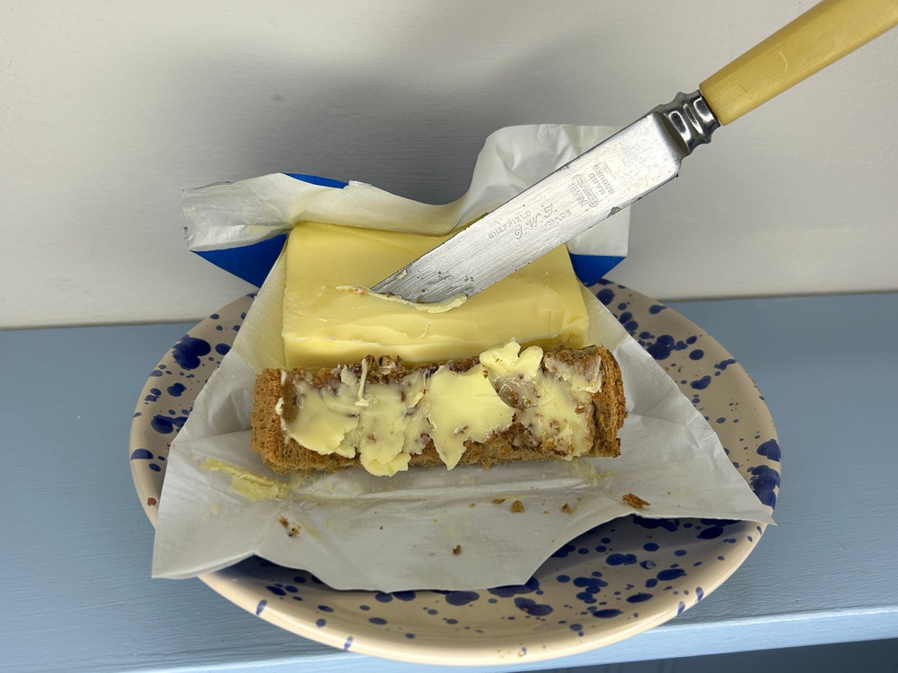 I got busy slathering the dairy spread on multiseed bread (Emma Henderson/The Independent)