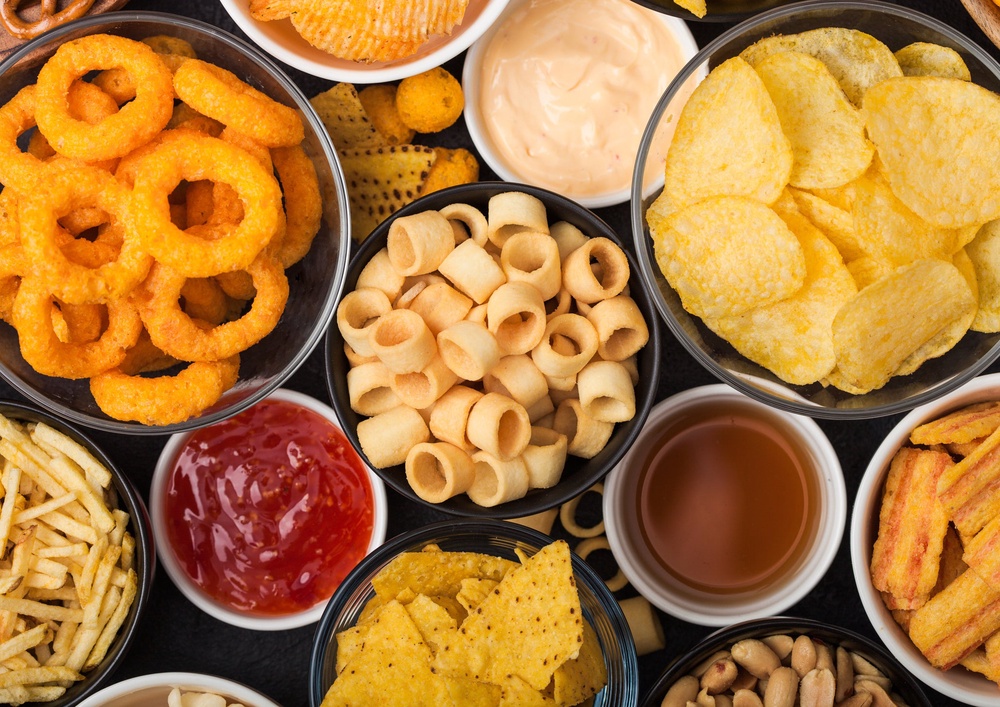 Staples such as biscuits, baked beans, marmalade, crisps, margarine, biscuits, chocolate and tomato ketchup could become cheaper (Getty/iStock)