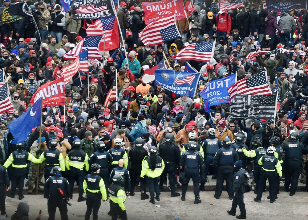 Trump’s government agreed that $1.776 billion in taxpayer funds be distributed to people who believe they were targeted by past administrations for prosecution for political purposes — including the Trump supporters imprisoned for attacking police while overrunning the U.S. Capitol in 2021 (AFP via Getty Images)