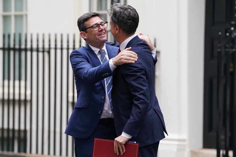 Andy Burnham and Ed Miliband (PA Archive)
