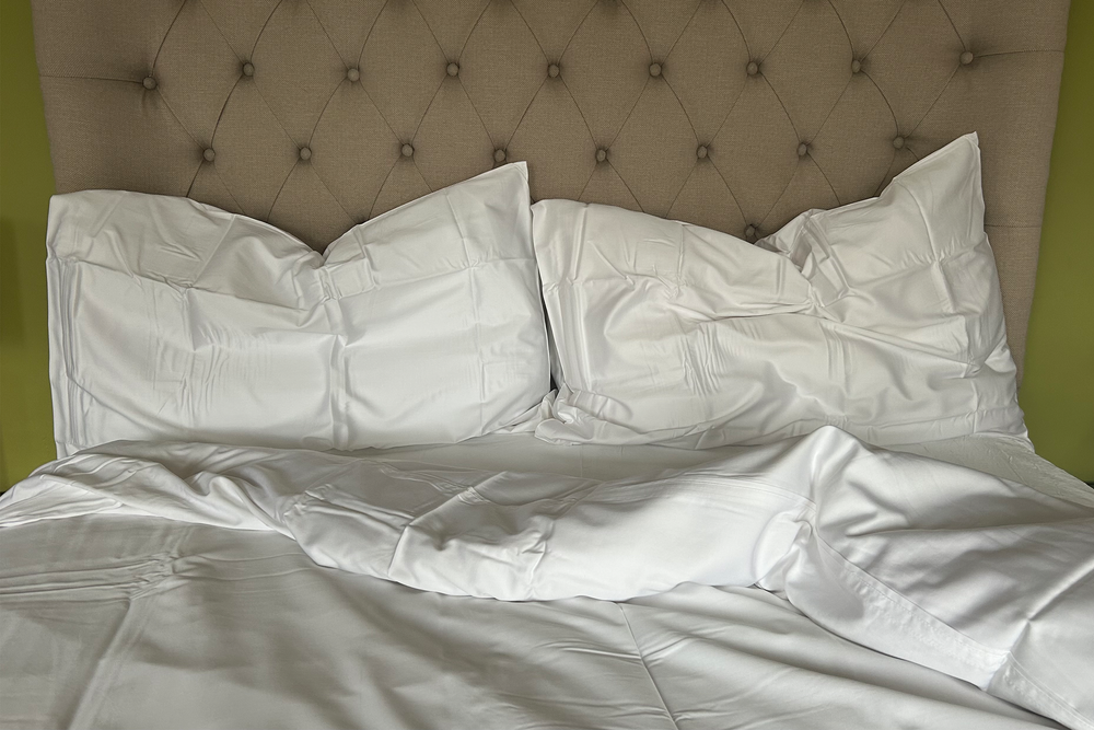 Button fastenings keep the duvet neatly in place (Ali Howard/The Independent)