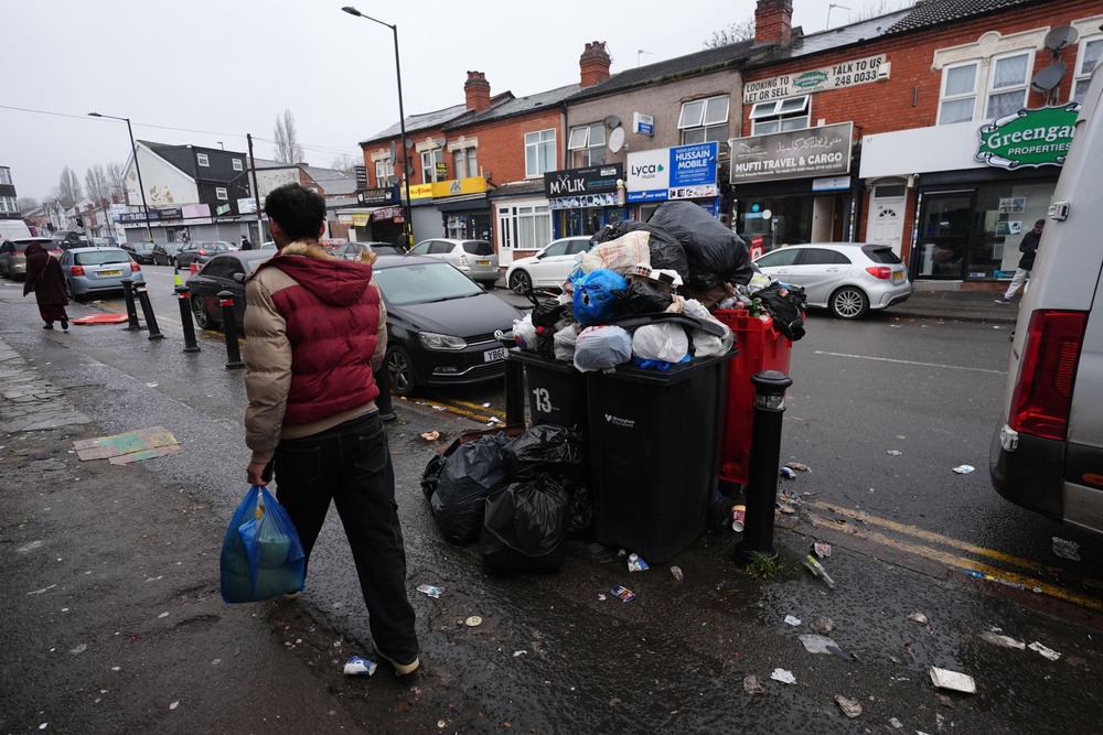 Rubbish piled up on Birmingham’s streets, creating fears of rodent-borne diseases spreading (PA)