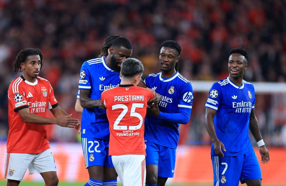 Gianluca Prestianni argues with Vinicius Jr during the Uefa Champions League knockout match in February (AFP/Getty)