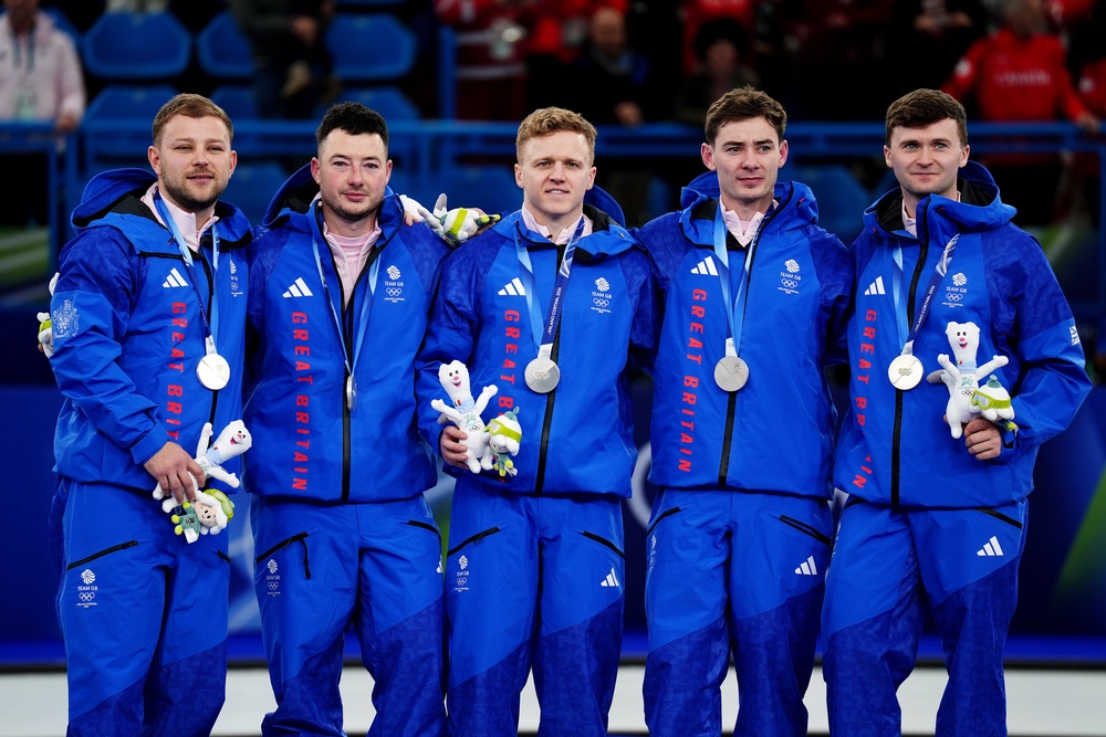She will team up with old partner Bobby Lammie (centre), a two-time Olympic men’s curling silver medallist (PA)