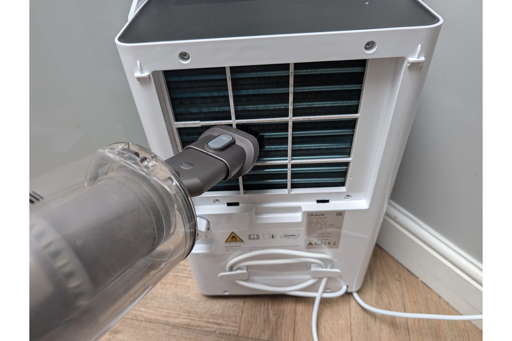 Use a vacuum cleaner gently to clean the coils (Joanne Lewsley/The Independent)