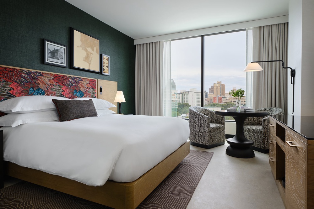 Bedrooms are sleek and spacious with gorgeous views of the skyline (Kimpton Santo San Antonio)