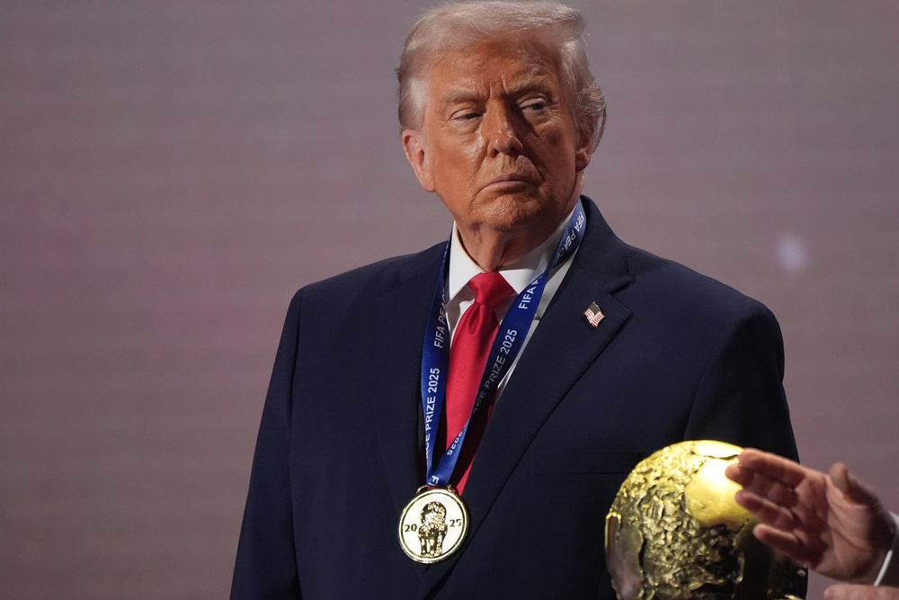President Donald Trump stands on stage next to the FIFA World Cup after receiving the FIFA Peace Prize during the draw for the 2026 soccer World Cup at the Kennedy Center in Washington, Dec. 5, 2025. (AP Photo/Jacquelyn Martin, File) (Copyright 2025 The Associated Press. All rights reserved)